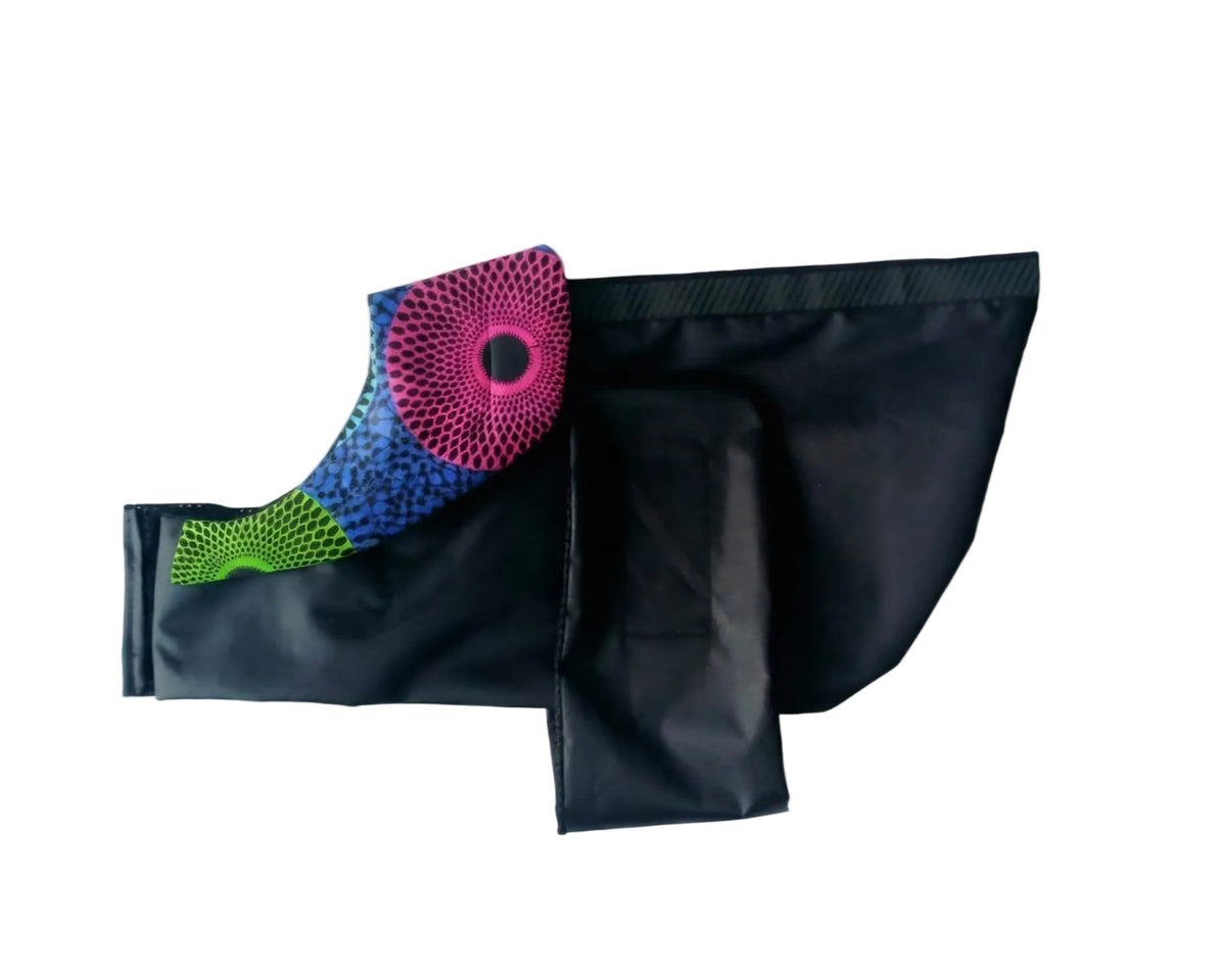 Black dog raincoat with Blue, Green and pink pattern collar.