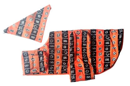 Orange and black patterned dog coat on a white background