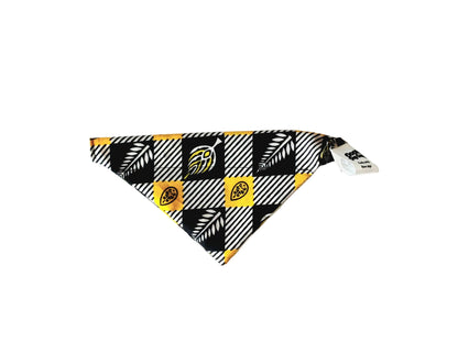 A triangular pet bandana featuring a black, white, and yellow checkered pattern with leaf and football motifs, displayed on a plain white background.