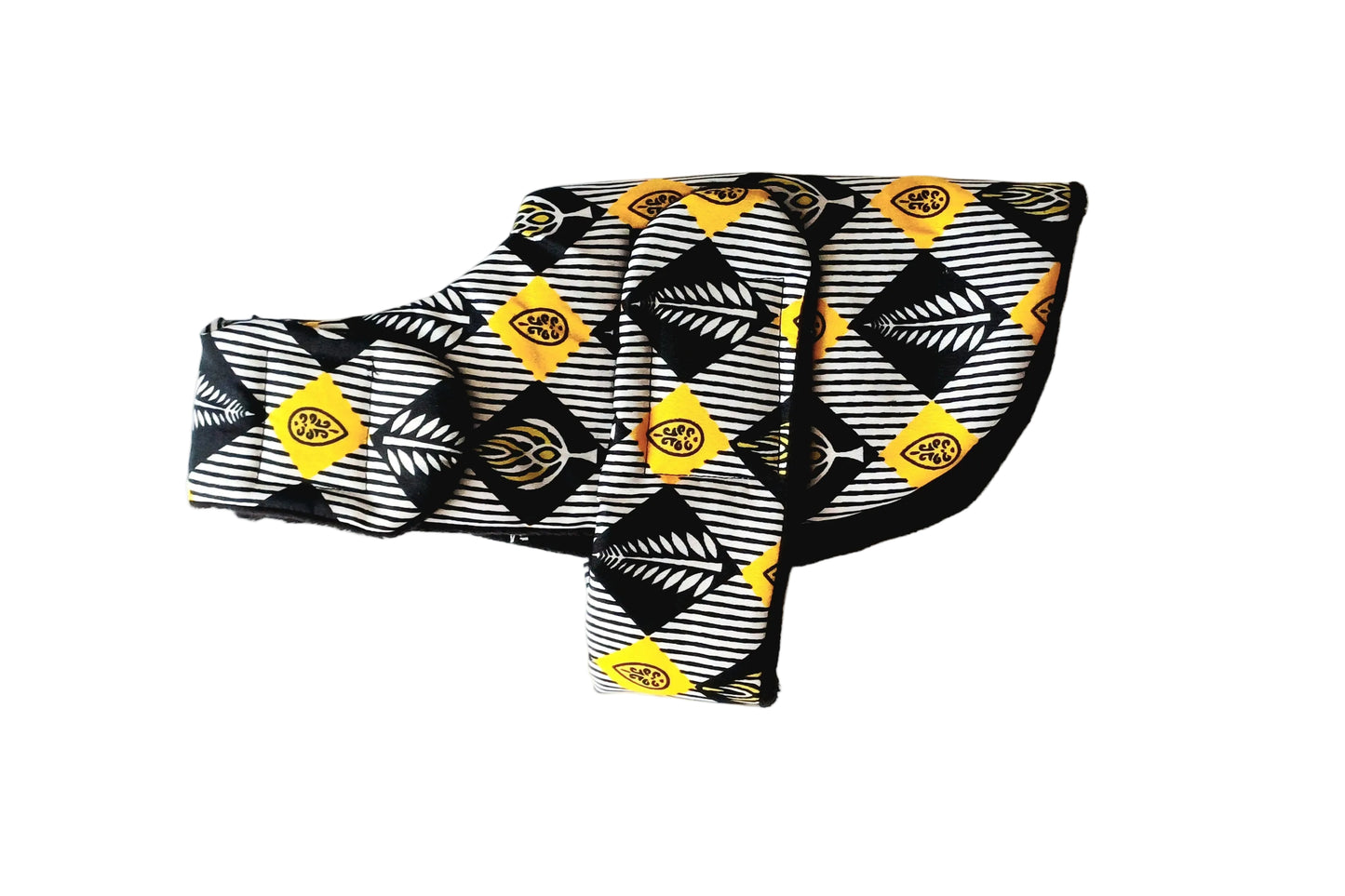 A dog coat featuring a bold geometric pattern in black, white, and yellow on a plain white background.