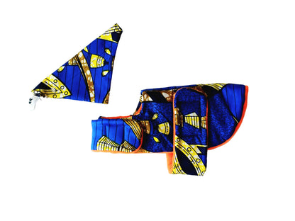A dog coat and bandana set laid flat on a white background with a bold blue, yellow, black, and orange geometric pattern.