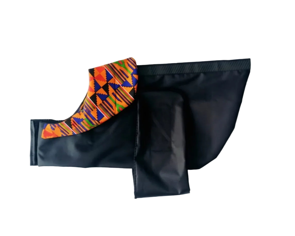 Black dog raincoat with Orange, Blue and Green African wax print collar.