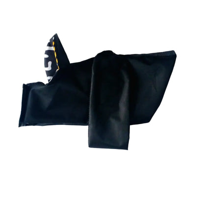 A black small dog raincoat, featuring a white and black patterned corner with yellow stitching, laid flat on a white background.