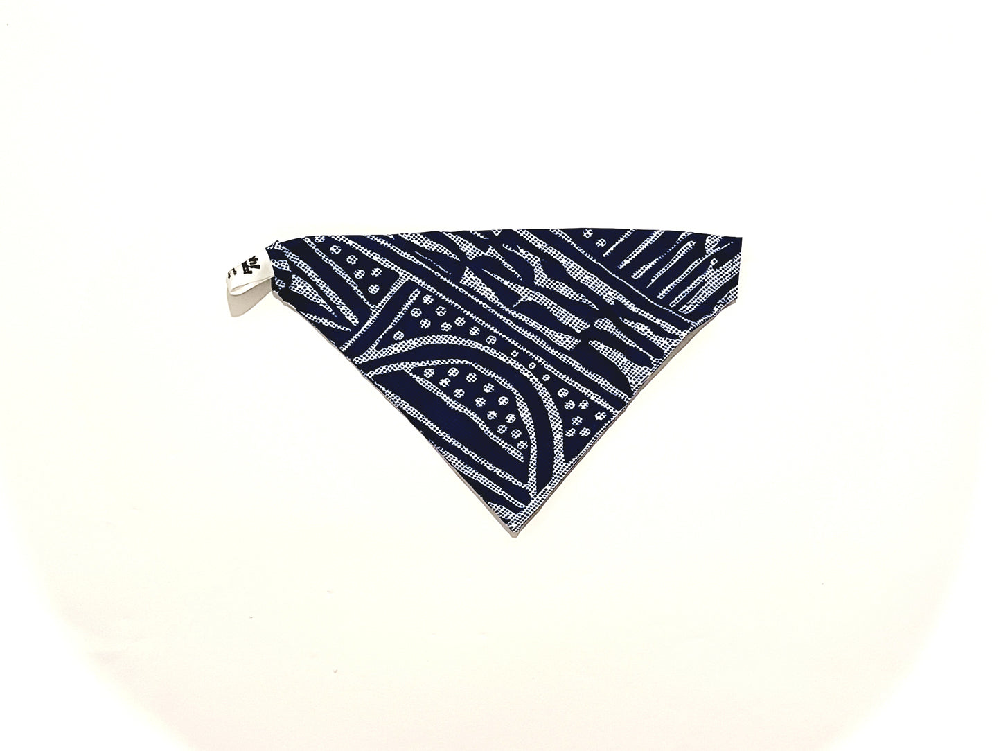 Navy blue bandana with white patterns on a white background
